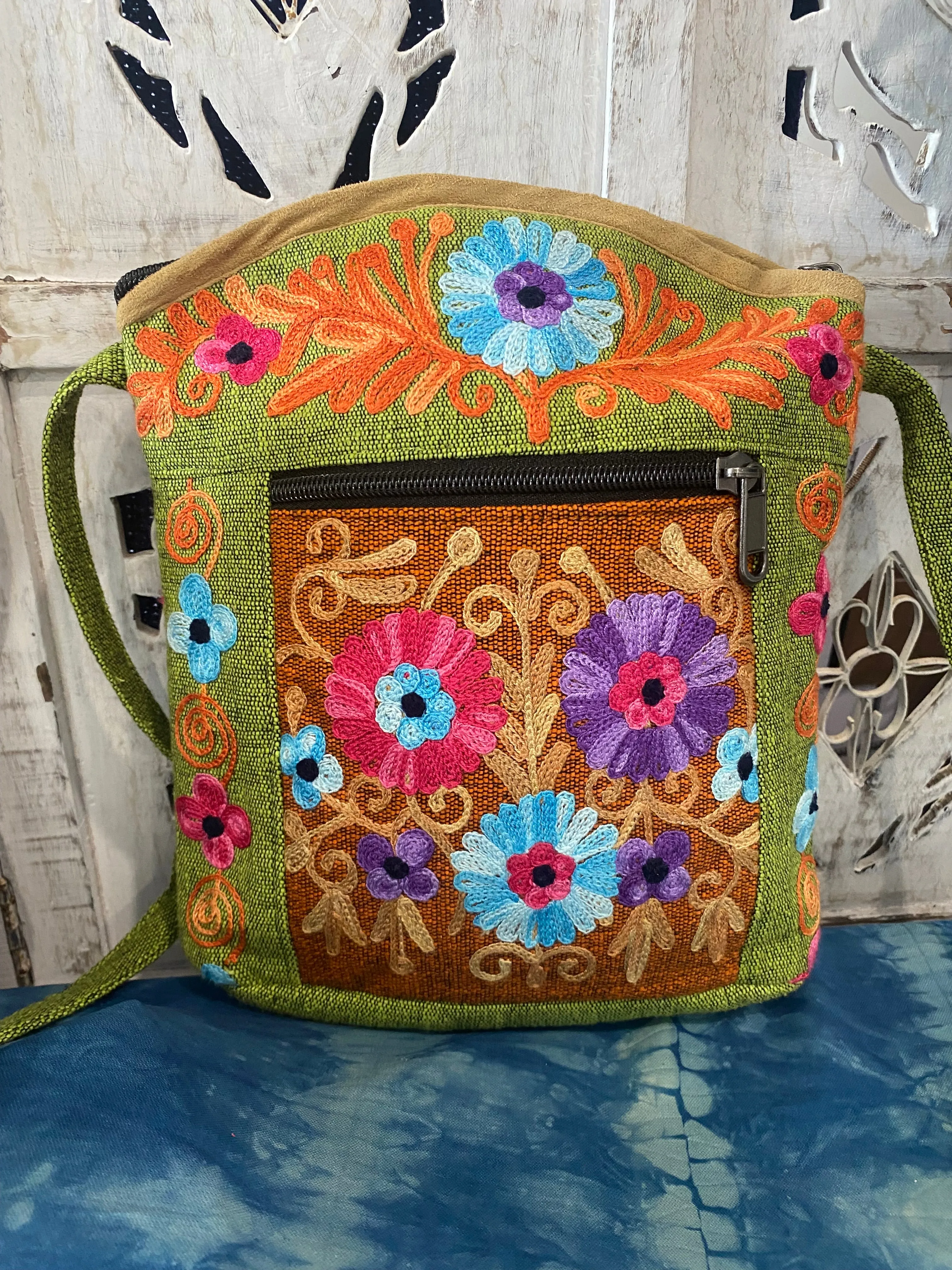 LWH Embroided Round Top Flower Handbag with shoulder strap.